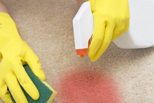 Customer raising a carpet cleaning complaint in a professional setting